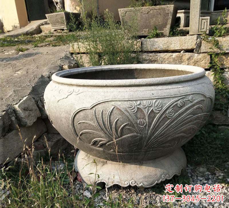 梅兰竹菊浮雕石水缸