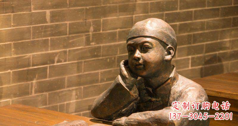 商场坐在桌前看书的小孩景观铜雕
