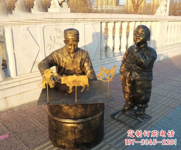 铜雕画糖人的人物