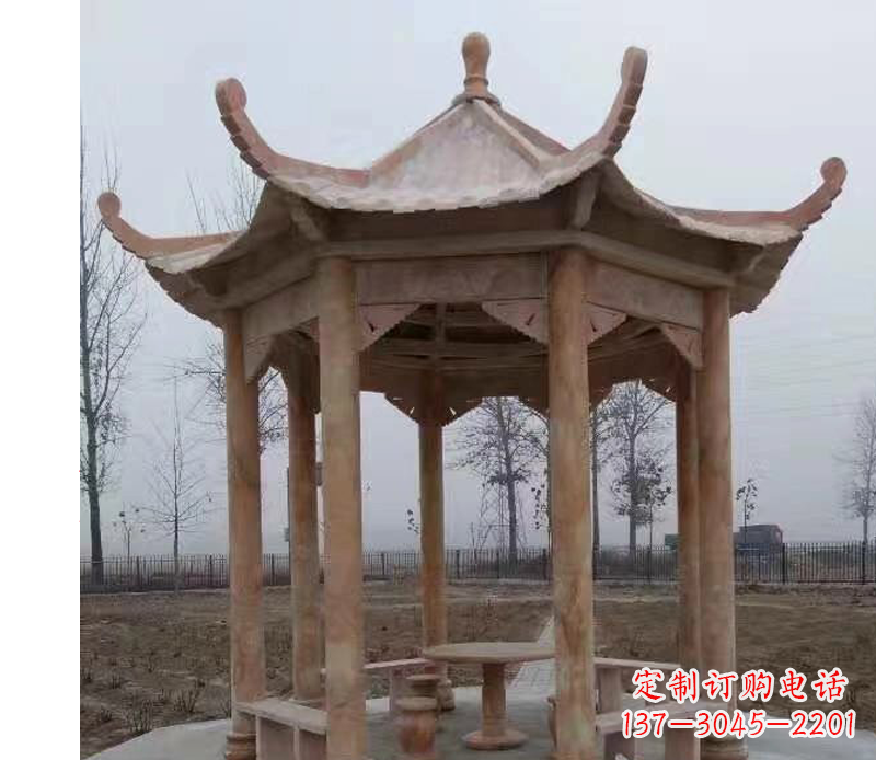 公园晚霞红八角石雕凉亭